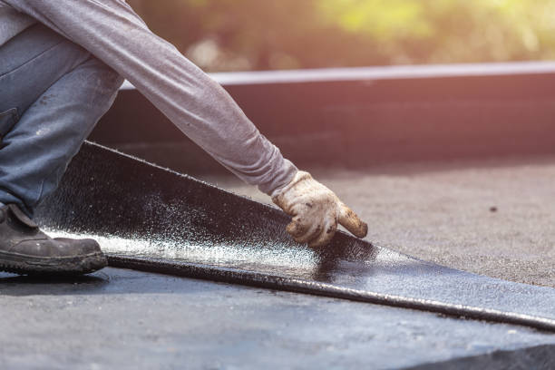 Professional Basement Waterproofing technician working in Robbins, NC